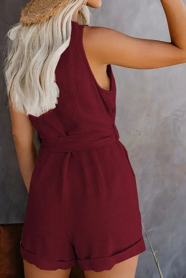Maroon romper worn by a person against a neutral background